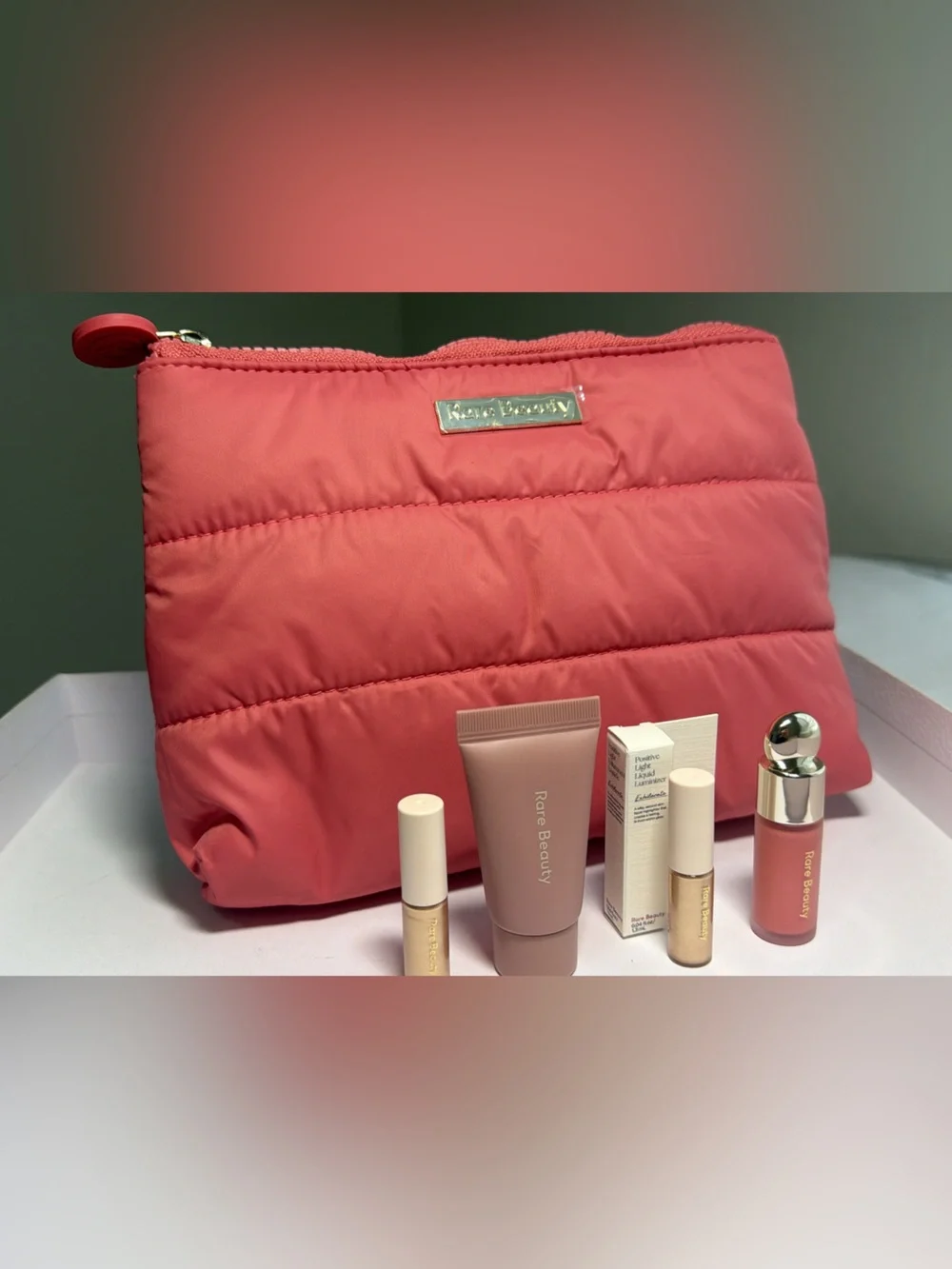 New,unused & authentic Rare Beauty Coral Pink Quilted Cosmetic Bag with samples
